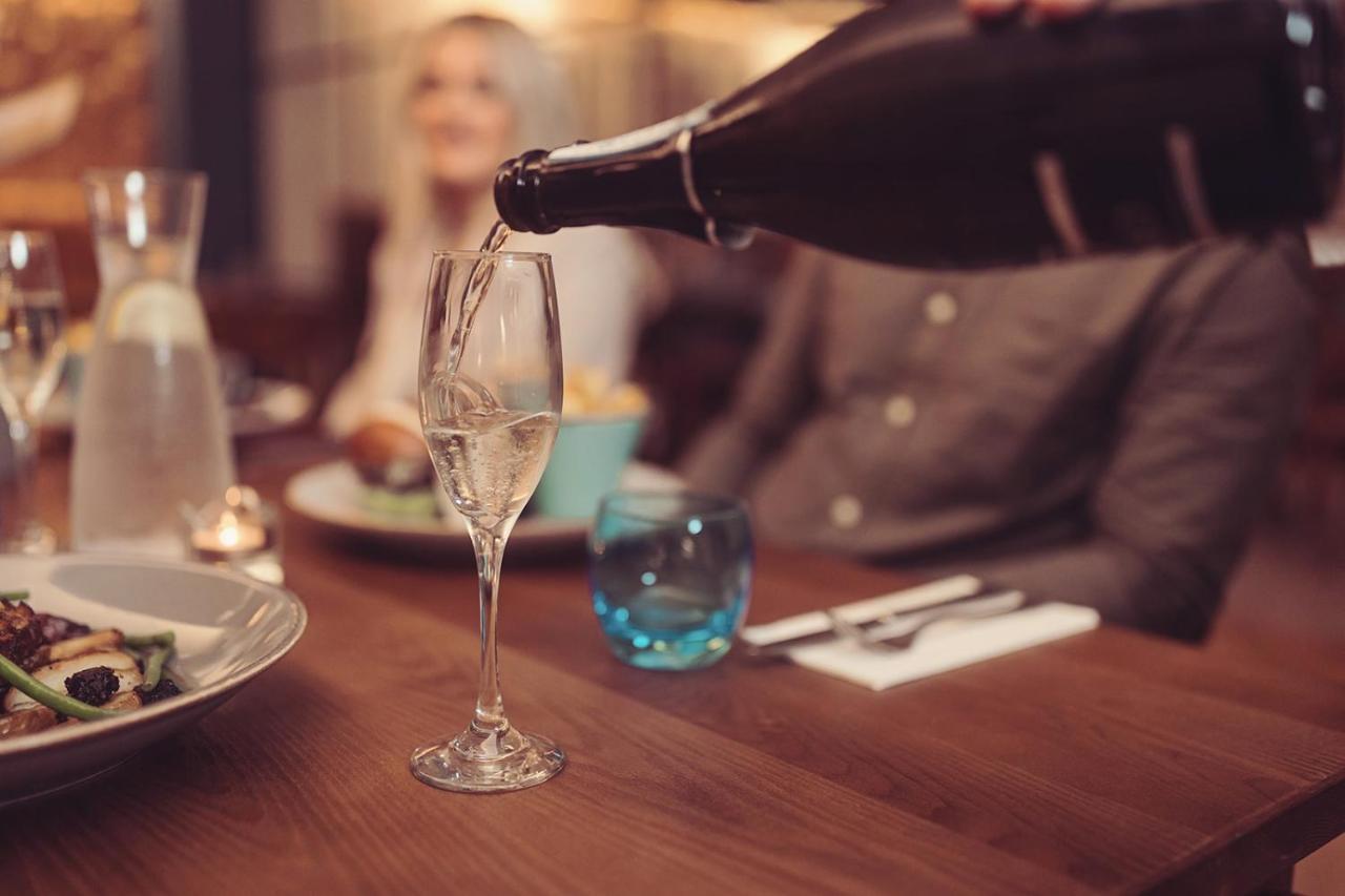 Longlands Inn & Cottages Carnforth Exteriér fotografie Champagne being poured
